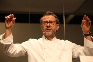 Chef Massimo Bottura gestures while speaking at the 2017 Science and Food Public Lecture at UCLA.