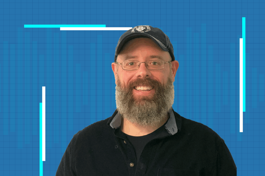 Professor Eric Deeds against a blue background with vertical light lines for the Science Interrupted podcast