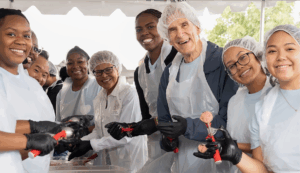 Naomi Hammonds and fellow UCLA volunteers wearing work gloves during a service day event at UCLA.