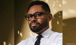 Terrence Keel, a UCLA professor, poses for a portrait in professional attire.