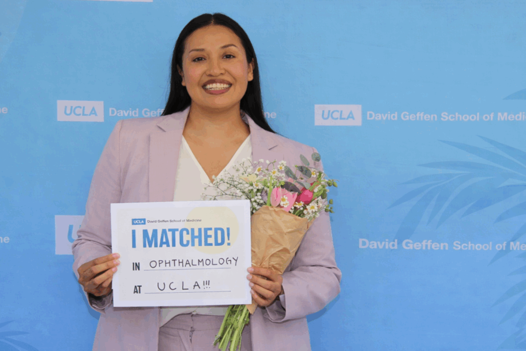 Karla Murillo holds "Match Day" sign